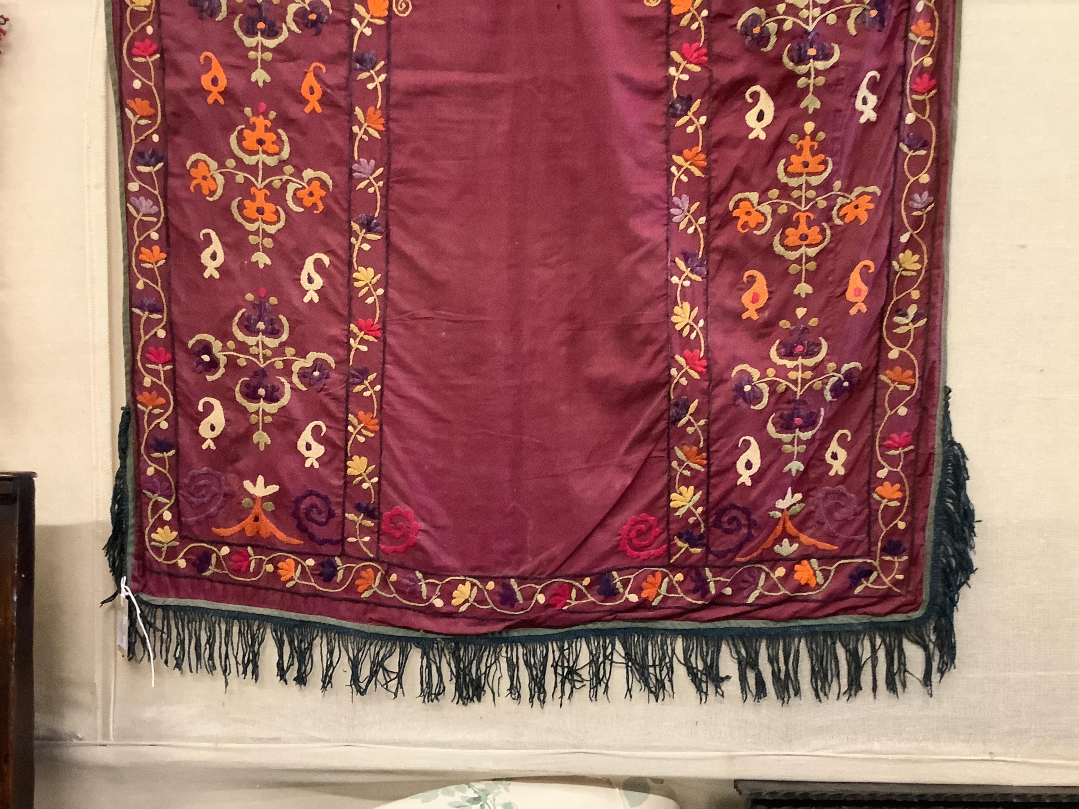 An early 20th century silk embroidered Uzbek Suzani, 120 x 92cm. Condition - fair